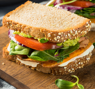 Sandwich with sweet potato, tomato and avocado